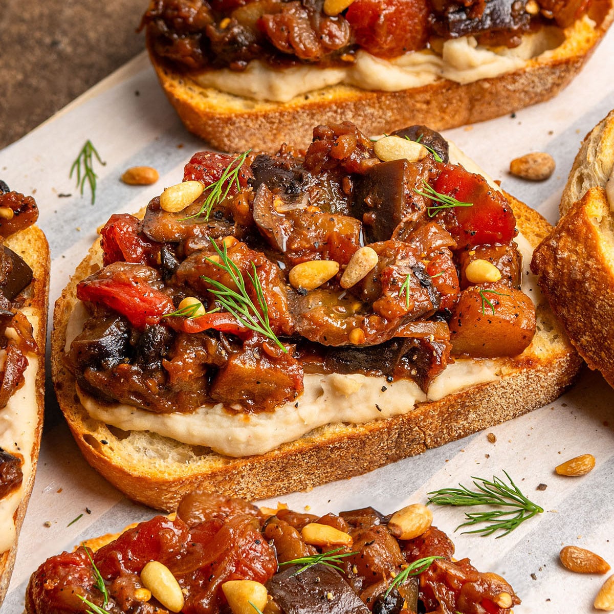 braised eggplant toast with garlic bean spread
