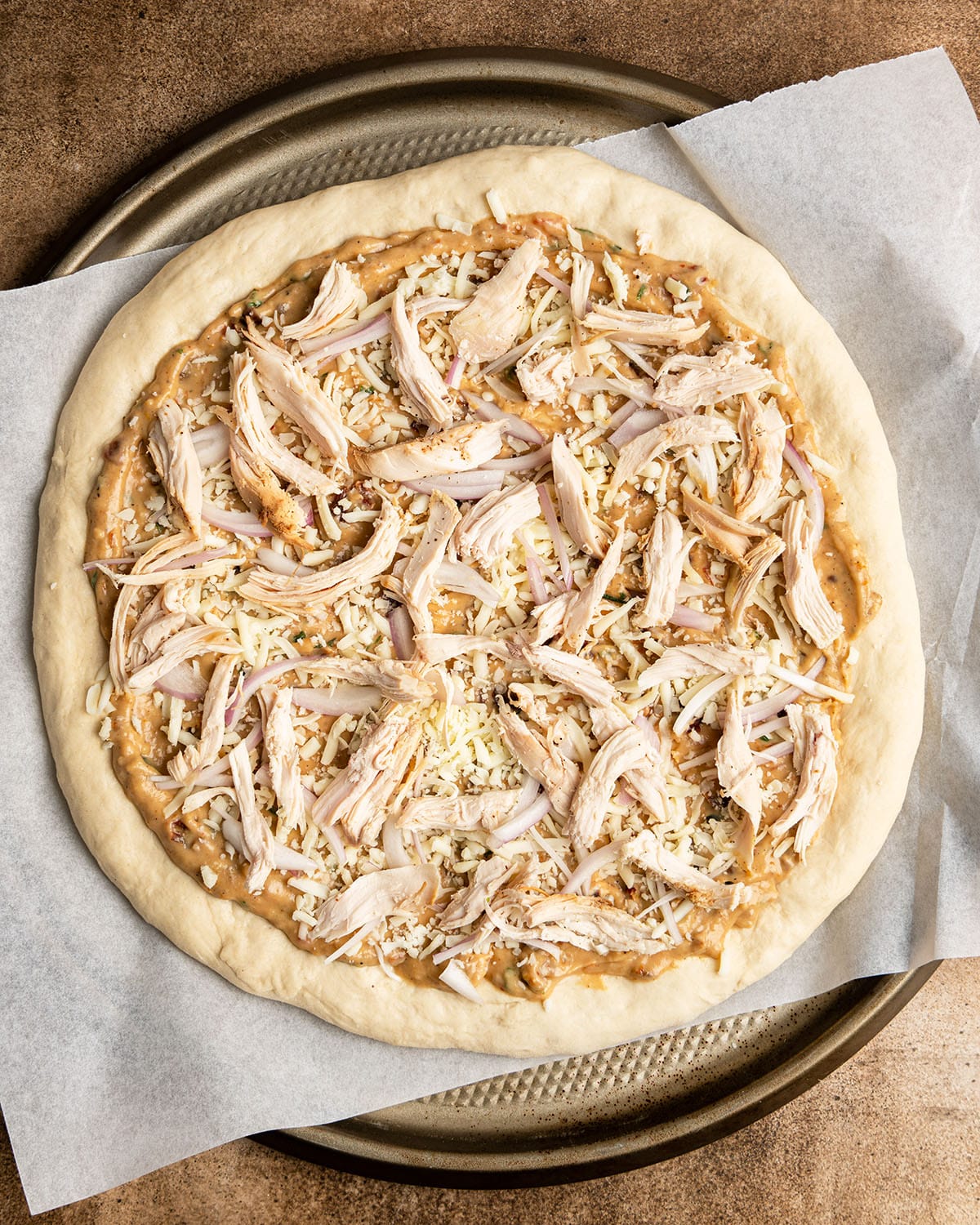 top with cheese, chicken, and shallot