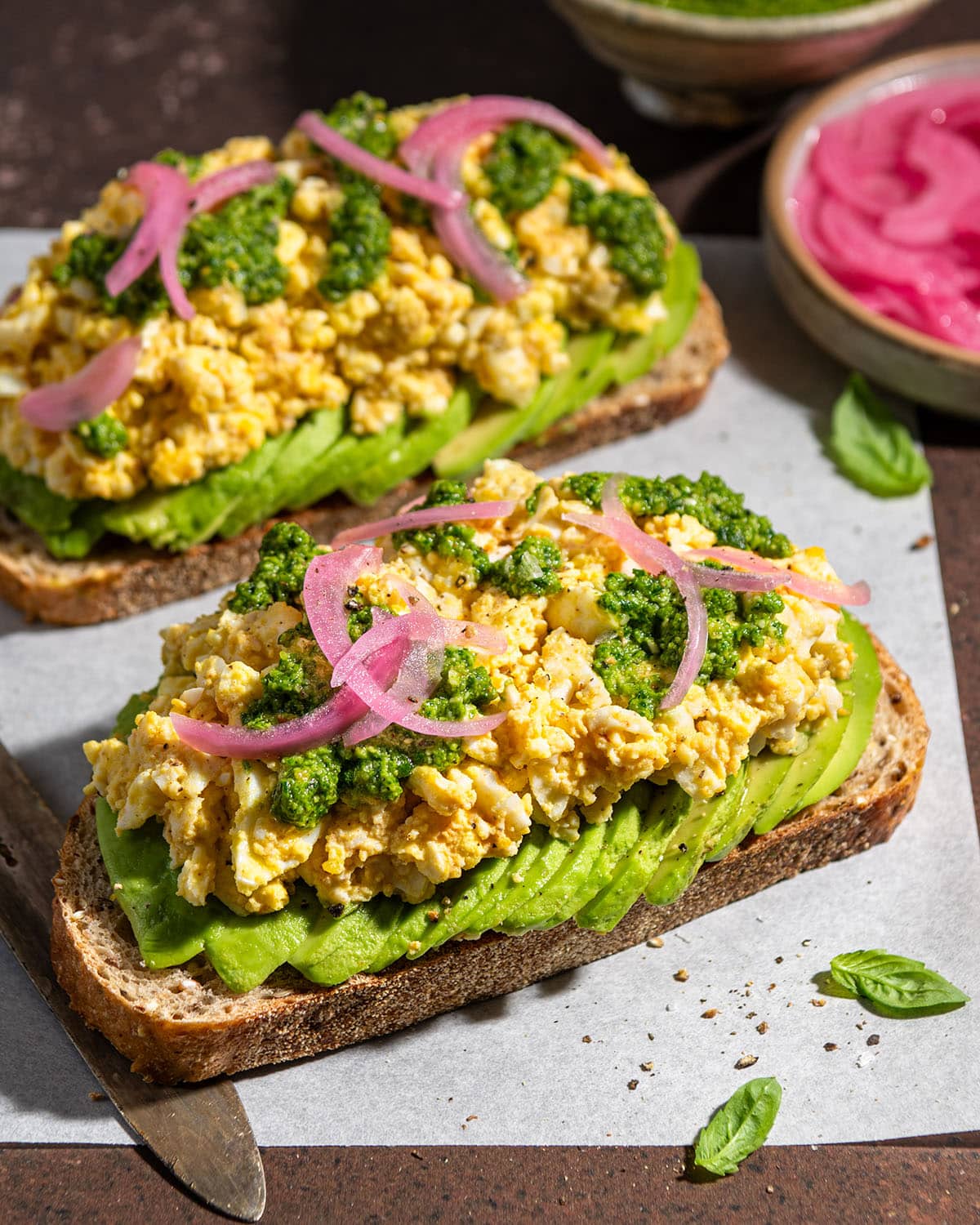 smashed egg avocado toast with spicy pesto