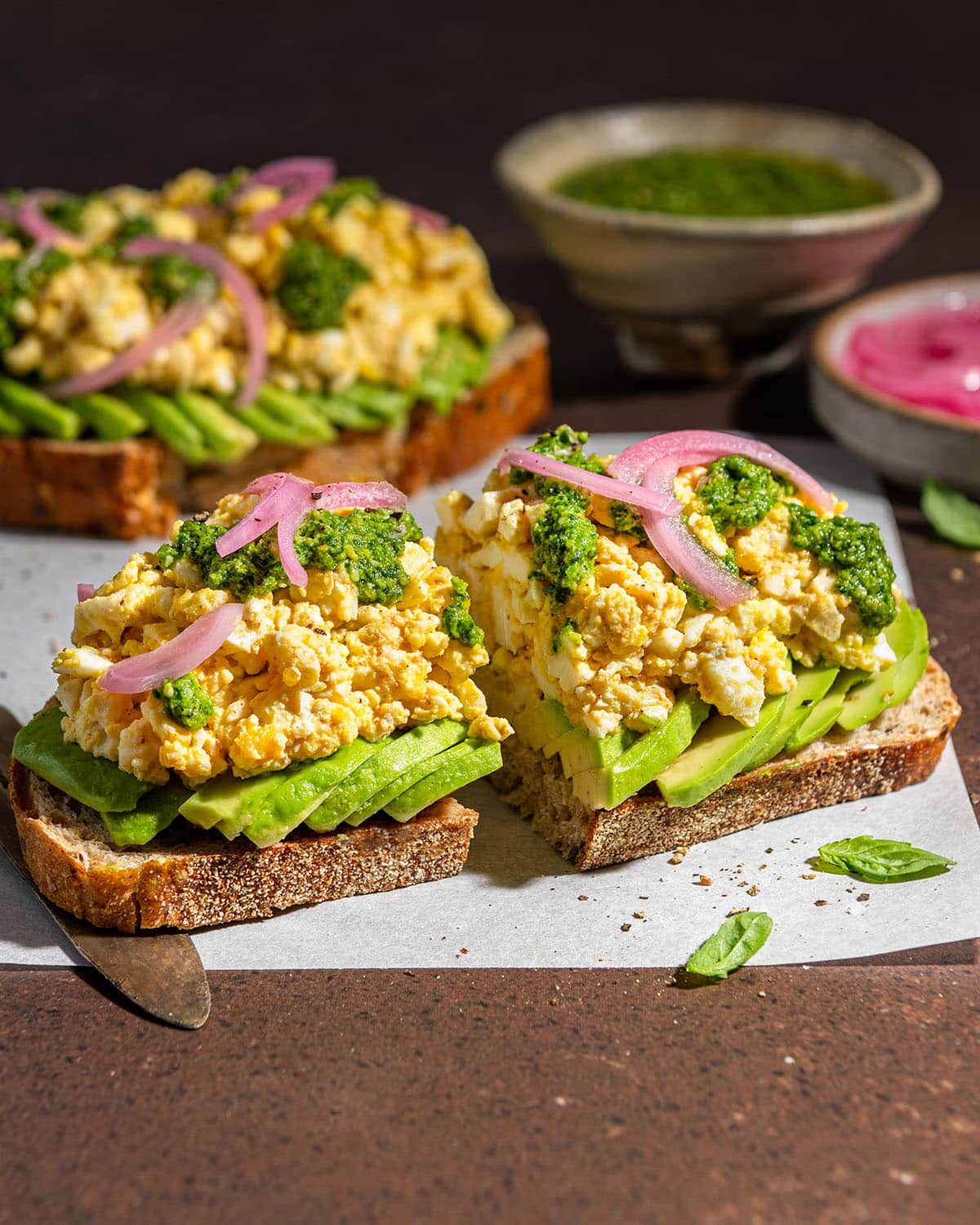 smashed egg avocado toast with spicy pesto