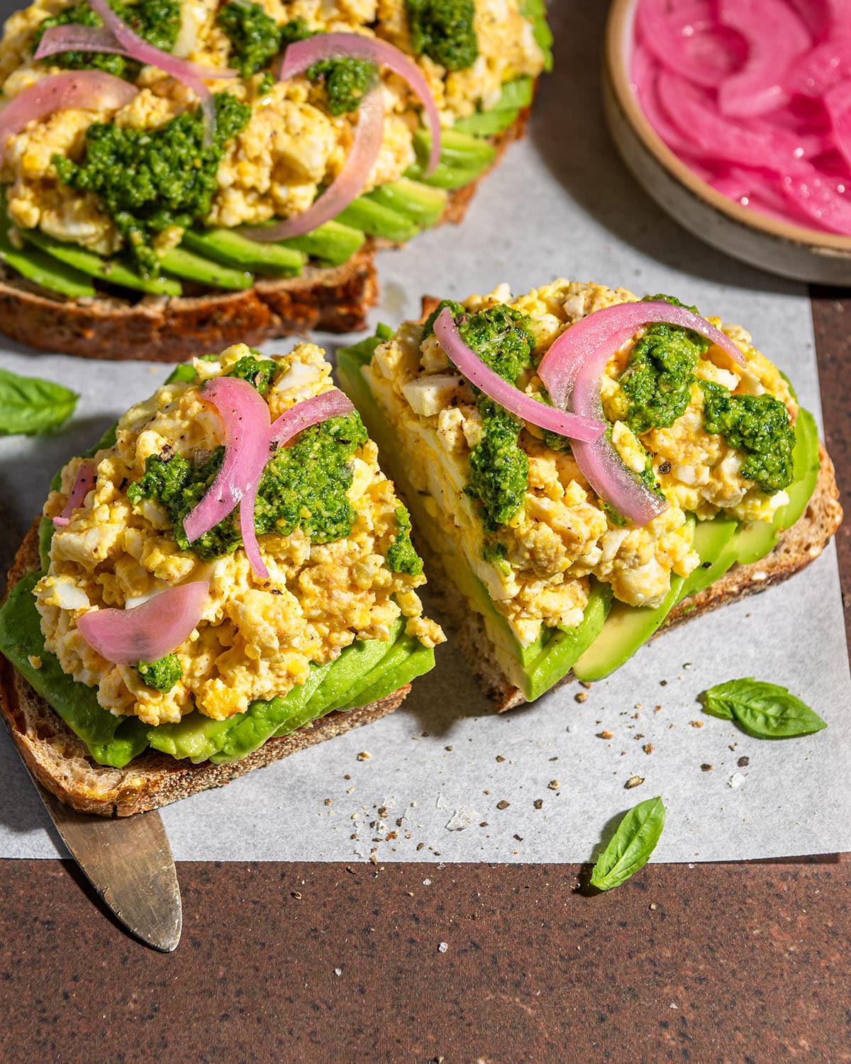 smashed egg avocado toast with spicy pesto