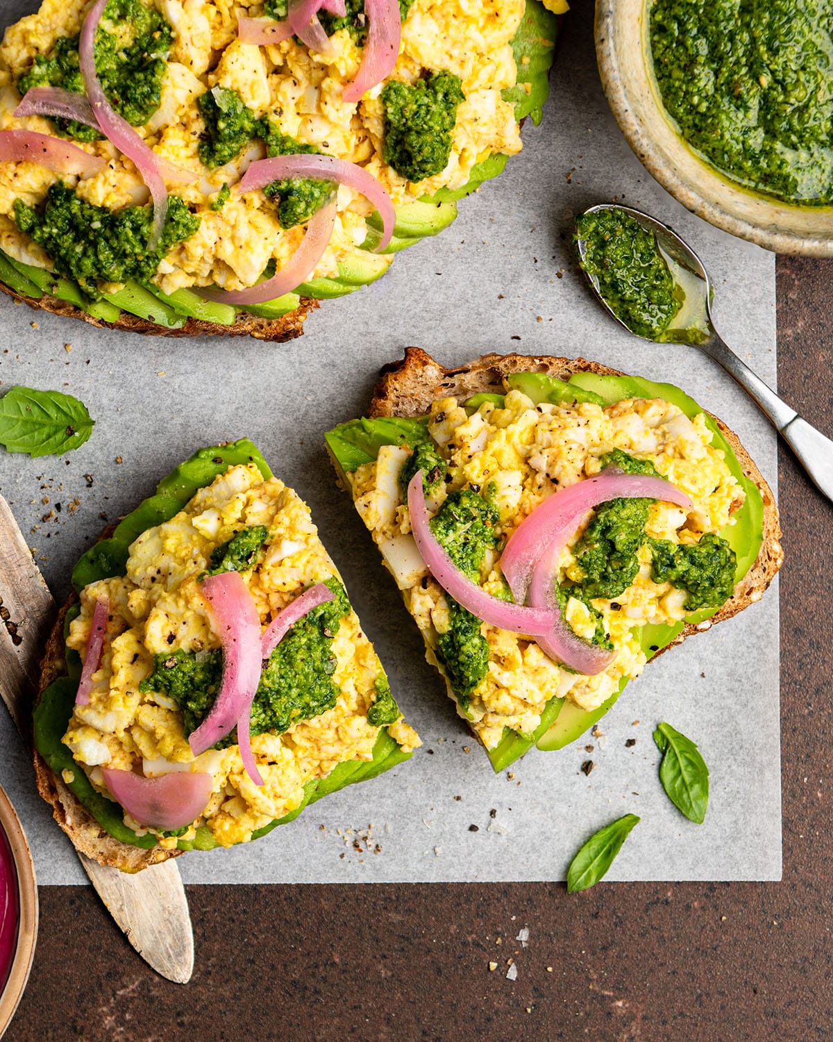 smashed egg avocado toast with spicy pesto