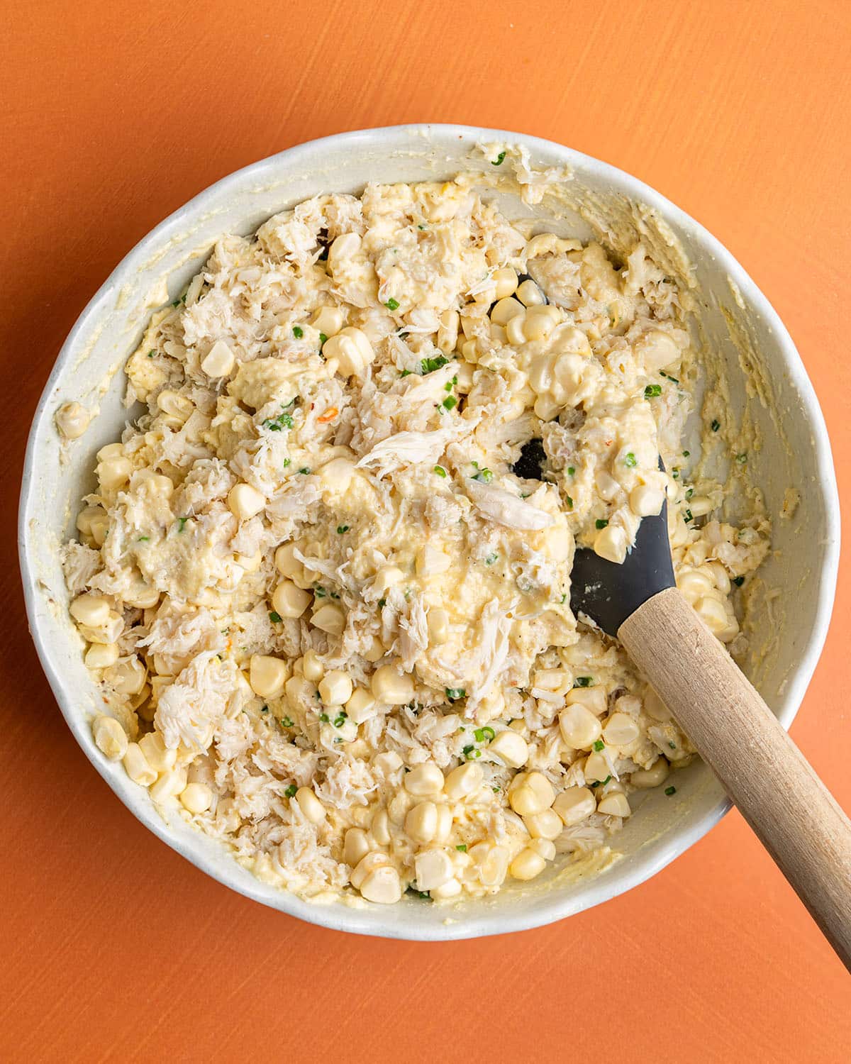 add corn, chives, and crab to beignet mixture