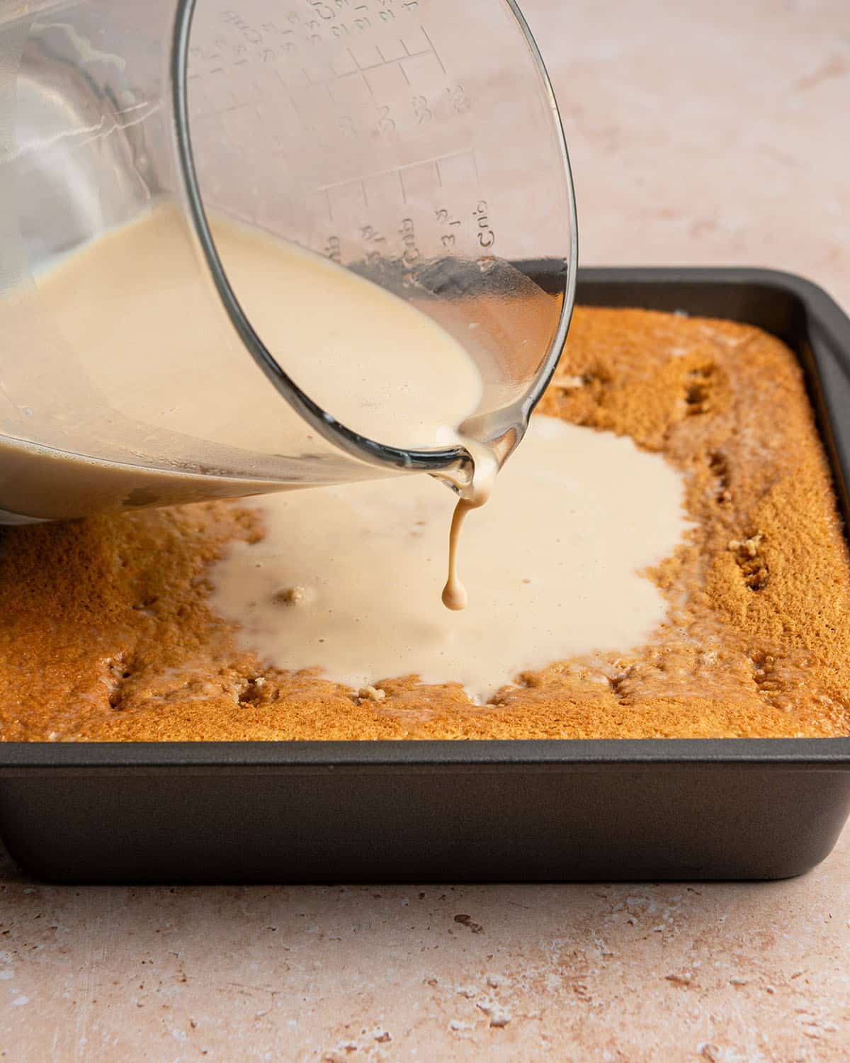 pour milk mixture on cake