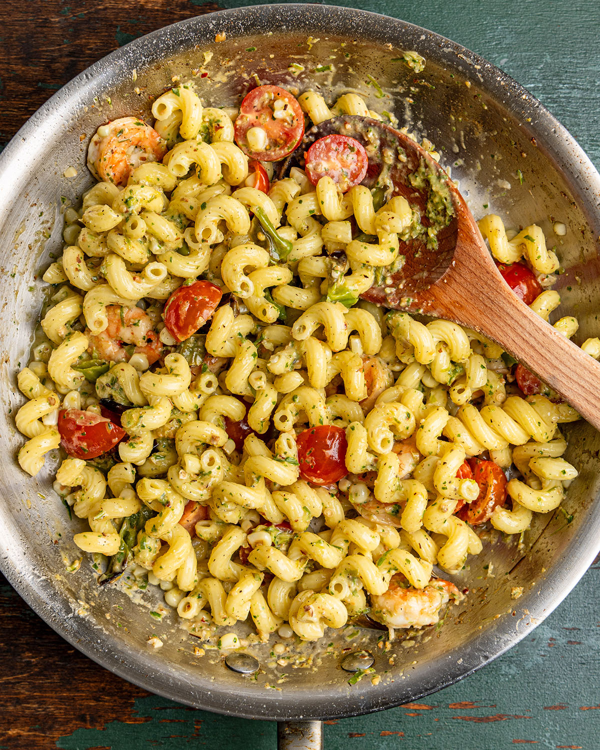 toss pasta with pesto sauce