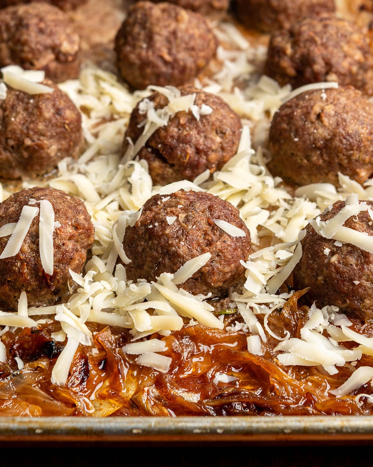 sprinkle cheese on meatballs